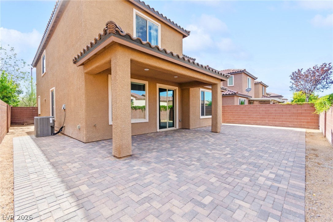 11048 Prairie Grove Road Las Vegas, NV 89179 - Photo 68 of 75 A spacious brick paver patio extends from the back of the home, offering an ideal spot for outdoor leisure.