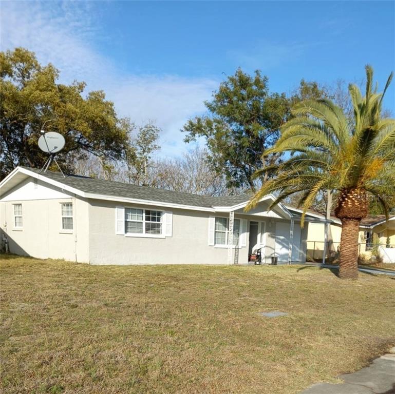 7521 Lancelot Road Port Richey, FL 34668 - Photo 1 of 1 a front view of a house with a tree