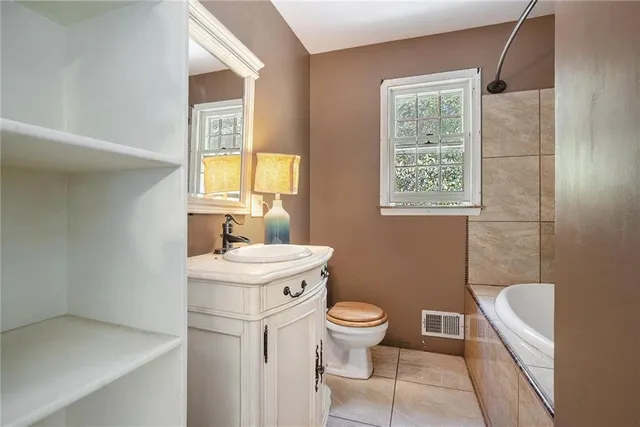 a bathroom with a bathtub and window