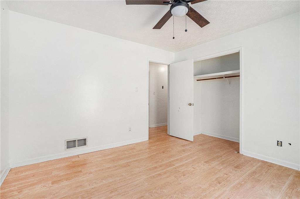 2358 Cannon Hill Road Southwest Lilburn, GA 30047 - Photo 18 of 22 wooden floor in an empty room