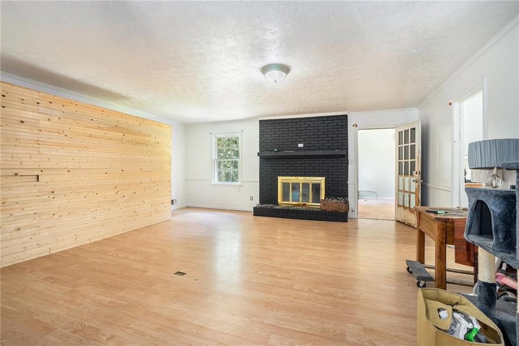 2358 Cannon Hill Road Southwest Lilburn, GA 30047 - Photo 2 of 22 a view of empty room with a fireplace