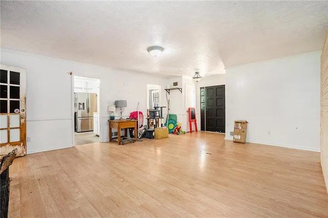 a view of a room with gym equipment and a large window