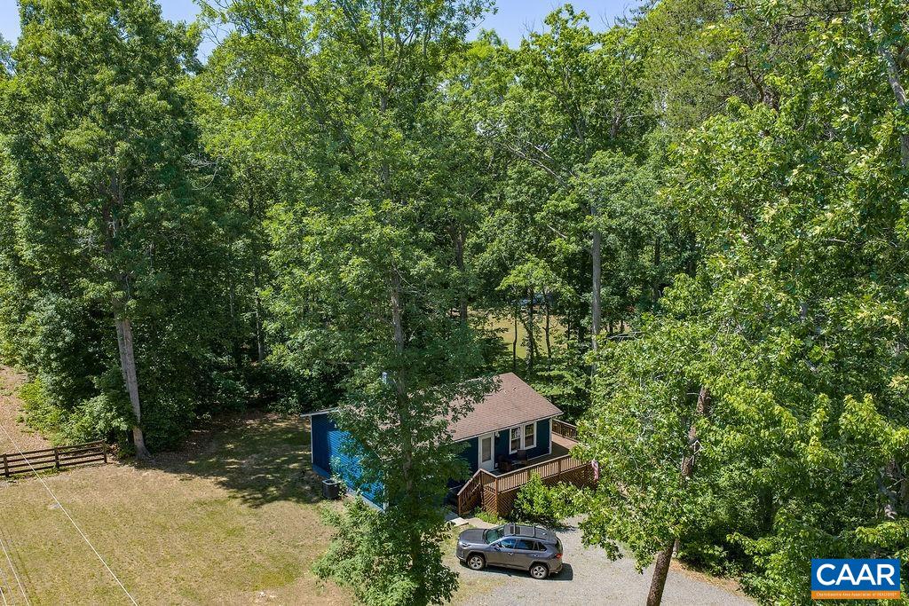 6920 Albevanna Spring Road Scottsville, VA 24590 - Photo 47 of 47 an aerial view of a house with swimming pool and garden