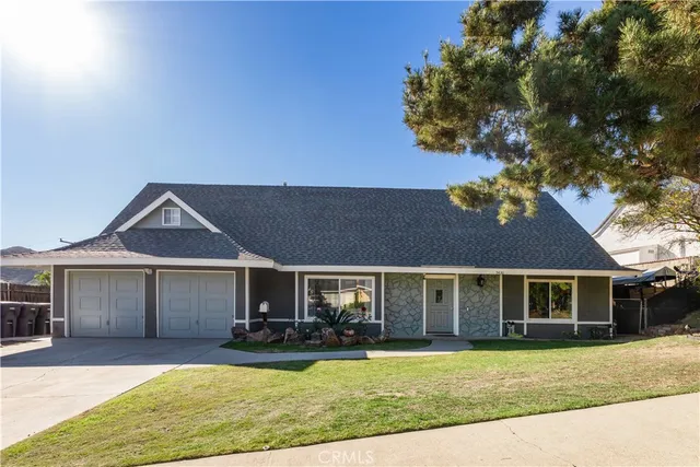 a view of a house with swimming pool and sitting area