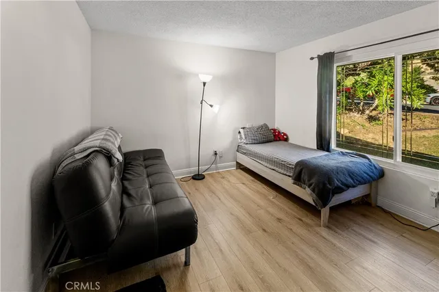 a bedroom with a bed and window