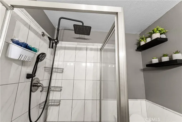 a bathroom with a bathtub and shower