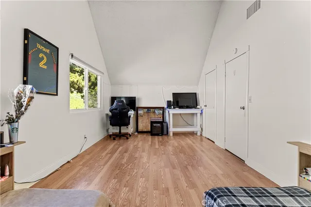 a view of kitchen with furniture and wooden floor