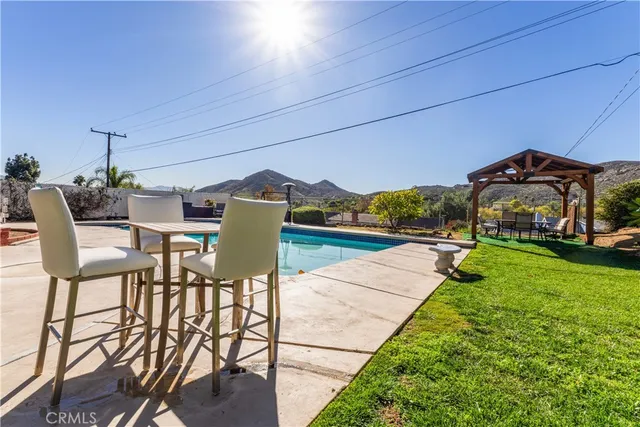 a view of a chairs and table in the patio