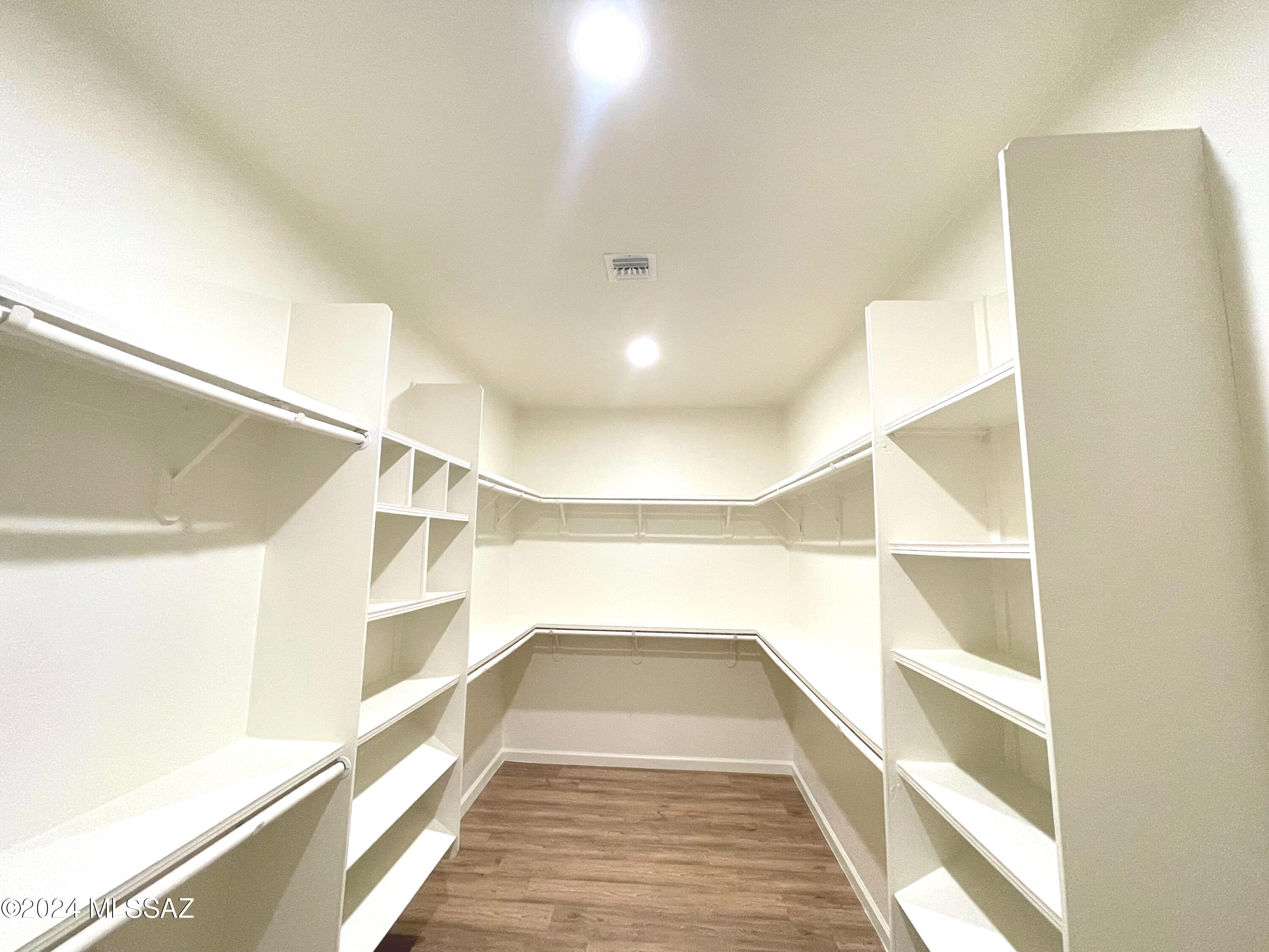 1835 San Diego Court Rio Rico, AZ 85648 - Photo 9 of 19 a view of a big room with wooden floor and windows