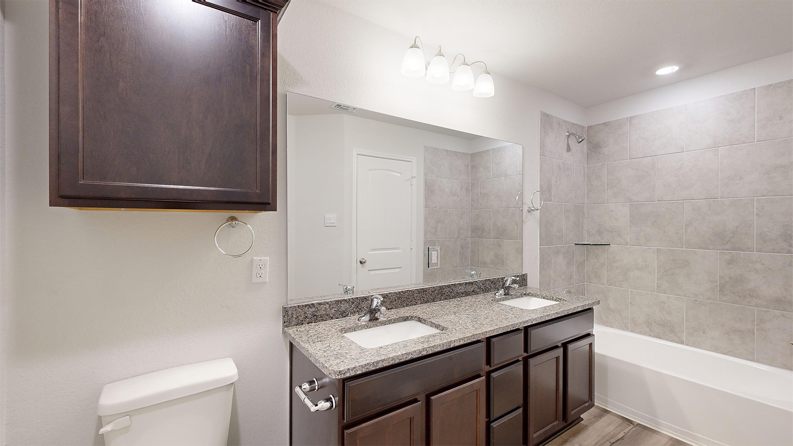 700 Gauge Road Thorndale, TX 76577 - Photo 20 of 22 Full bathroom with bathtub / shower combination and double vanity