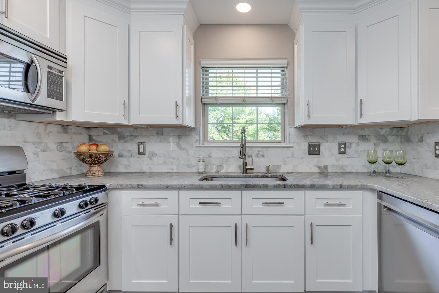 11 Pavilion Road Voorhees, NJ 08043 - Photo 12 of 43 a kitchen with granite countertop white cabinets and white appliances
