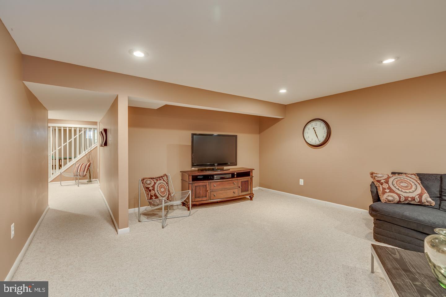 11 Pavilion Road Voorhees, NJ 08043 - Photo 24 of 43 a living room with furniture and a flat screen tv