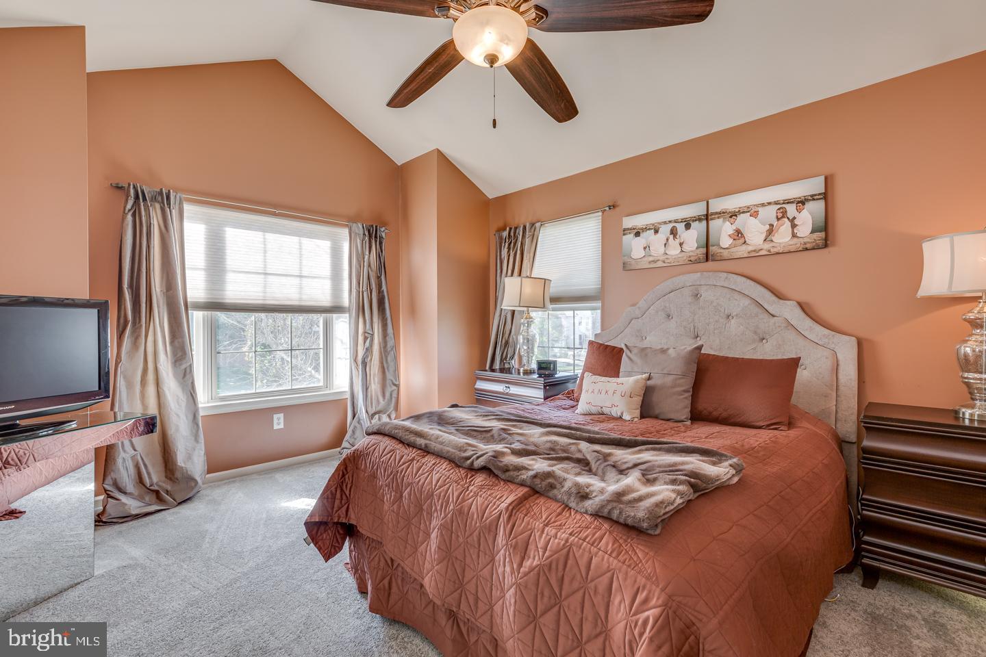 11 Pavilion Road Voorhees, NJ 08043 - Photo 26 of 43 a bedroom with a large bed and a chandelier