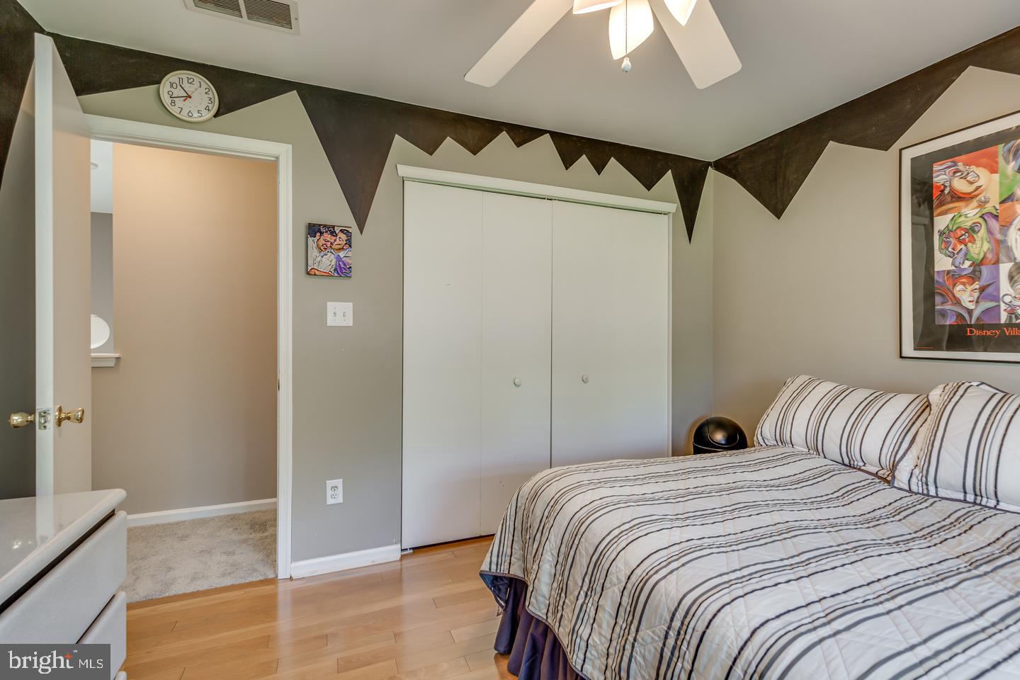 11 Pavilion Road Voorhees, NJ 08043 - Photo 37 of 43 a bedroom with a bed and a painting on the wall