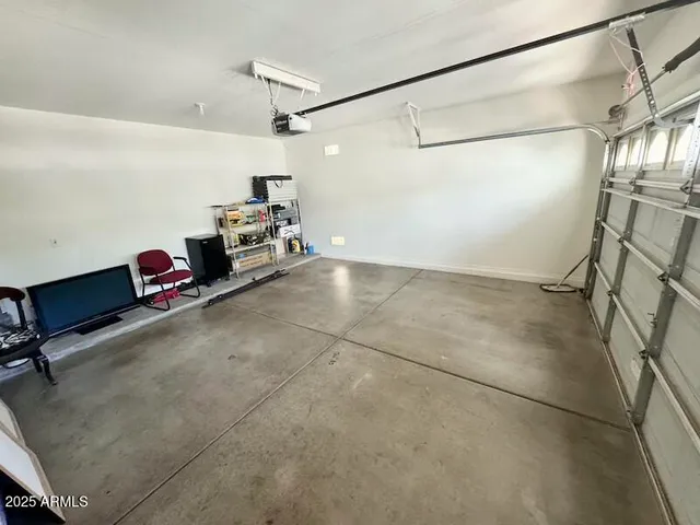 a room with water heater and refrigerator