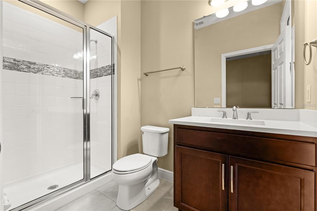 7757 Marsala Street Clermont, FL 34714 - Photo 19 of 75 a bathroom with a sink a toilet and shower