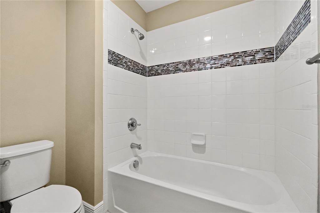 7757 Marsala Street Clermont, FL 34714 - Photo 25 of 75 a bathroom with a toilet a sink and a bathtub