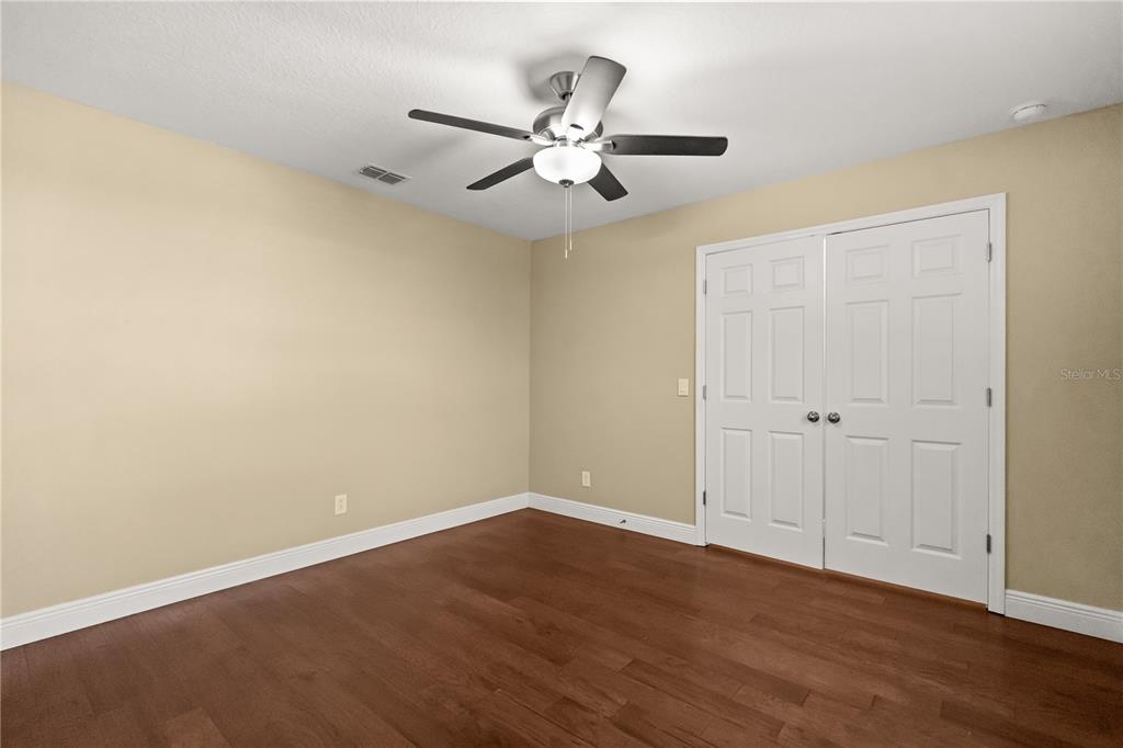 7757 Marsala Street Clermont, FL 34714 - Photo 27 of 75 a view of an empty room with wooden floor