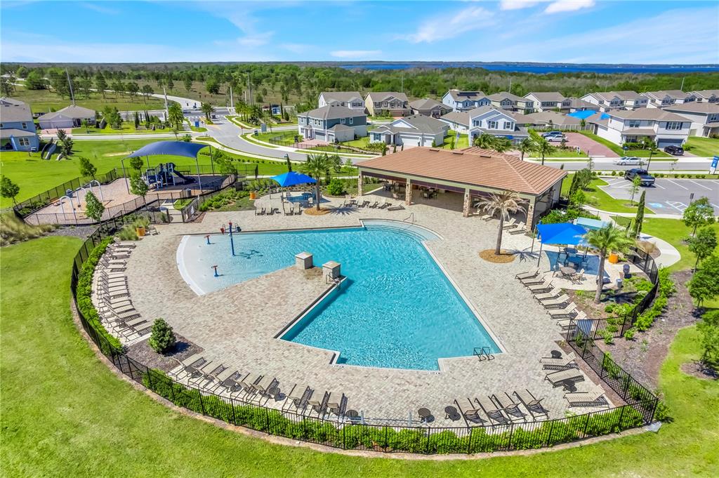 7757 Marsala Street Clermont, FL 34714 - Photo 4 of 75 an aerial view of a house with a swimming pool yard and outdoor seating