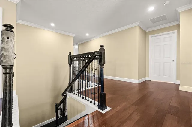 a view of a hallway with stairs