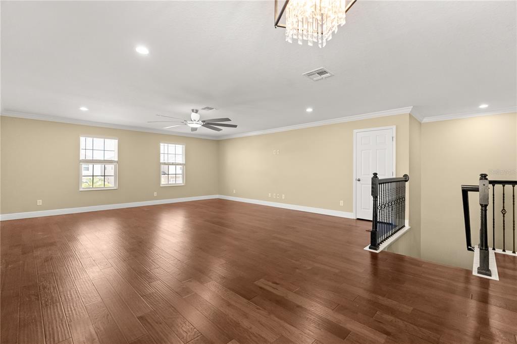7757 Marsala Street Clermont, FL 34714 - Photo 45 of 75 a view of a room with gym equipment and windows