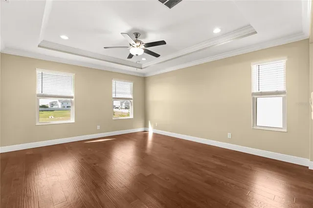 a view of building with yard in front of it