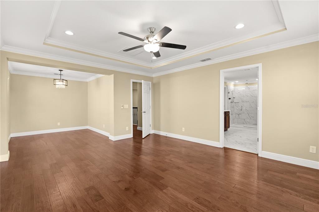 7757 Marsala Street Clermont, FL 34714 - Photo 48 of 75 a view of an empty room with wooden floor