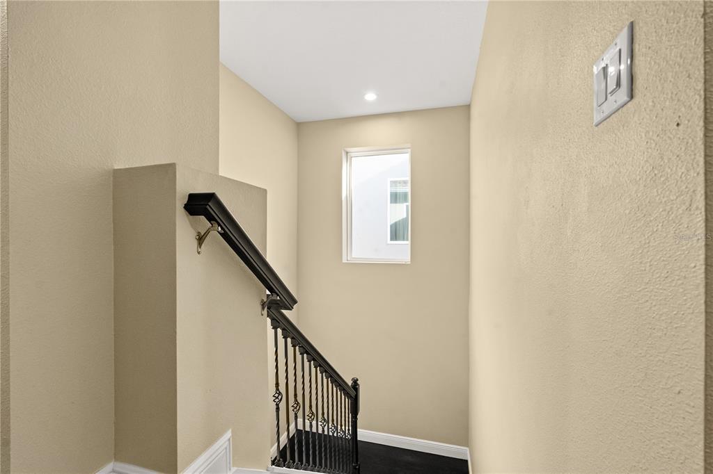 7757 Marsala Street Clermont, FL 34714 - Photo 60 of 75 a view of a hallway with stairs