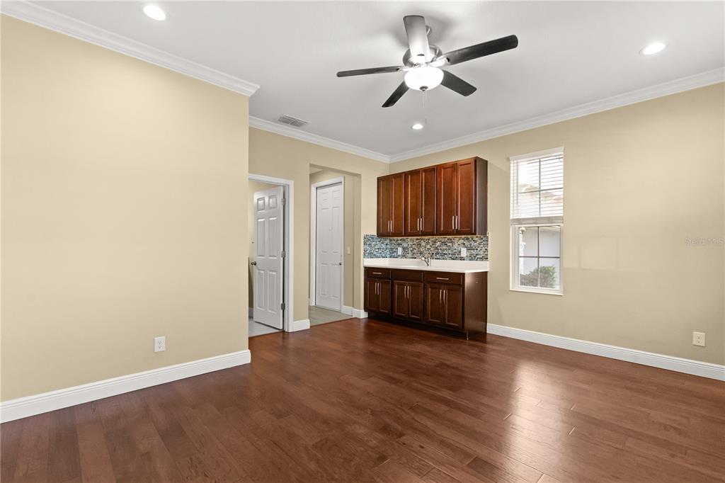 7757 Marsala Street Clermont, FL 34714 - Photo 62 of 75 a view of kitchen with microwave and window