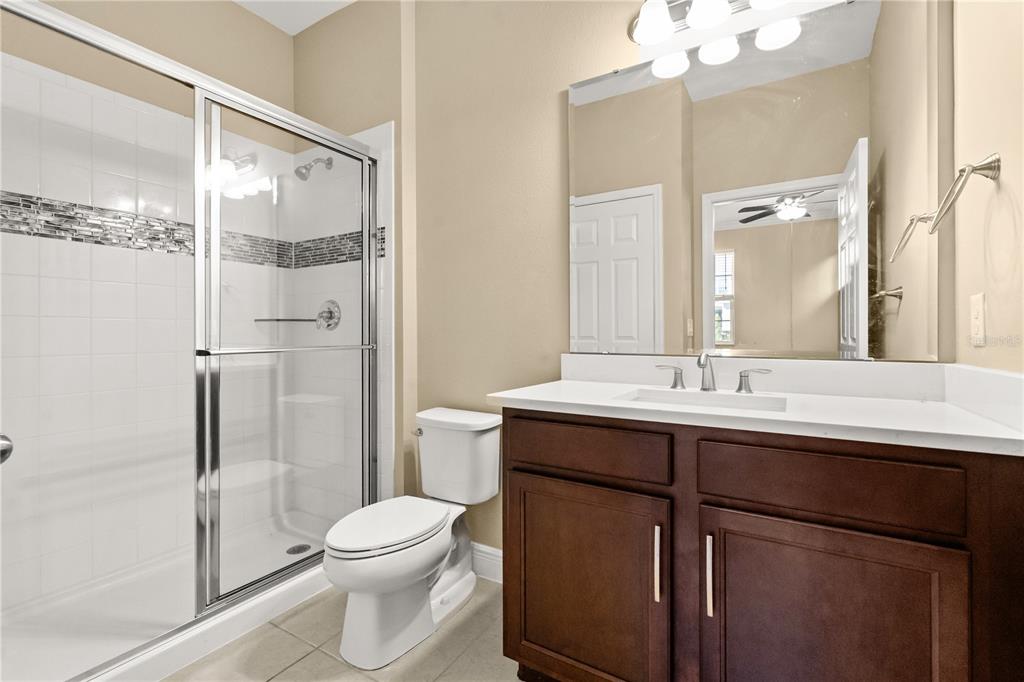 7757 Marsala Street Clermont, FL 34714 - Photo 64 of 75 a bathroom with a sink toilet and shower