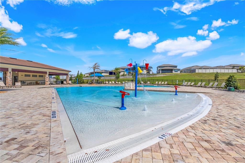 7757 Marsala Street Clermont, FL 34714 - Photo 73 of 75 a view of a swimming pool with an outdoor seating