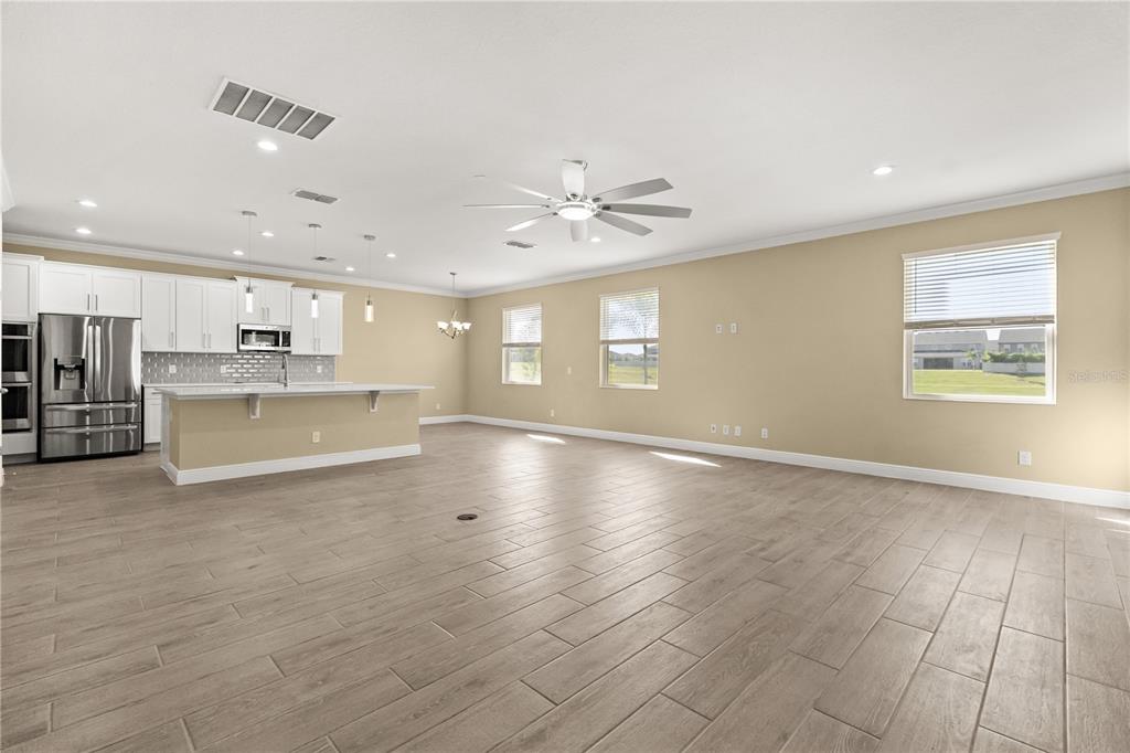 7757 Marsala Street Clermont, FL 34714 - Photo 8 of 75 a view of a kitchen with an empty space and a window