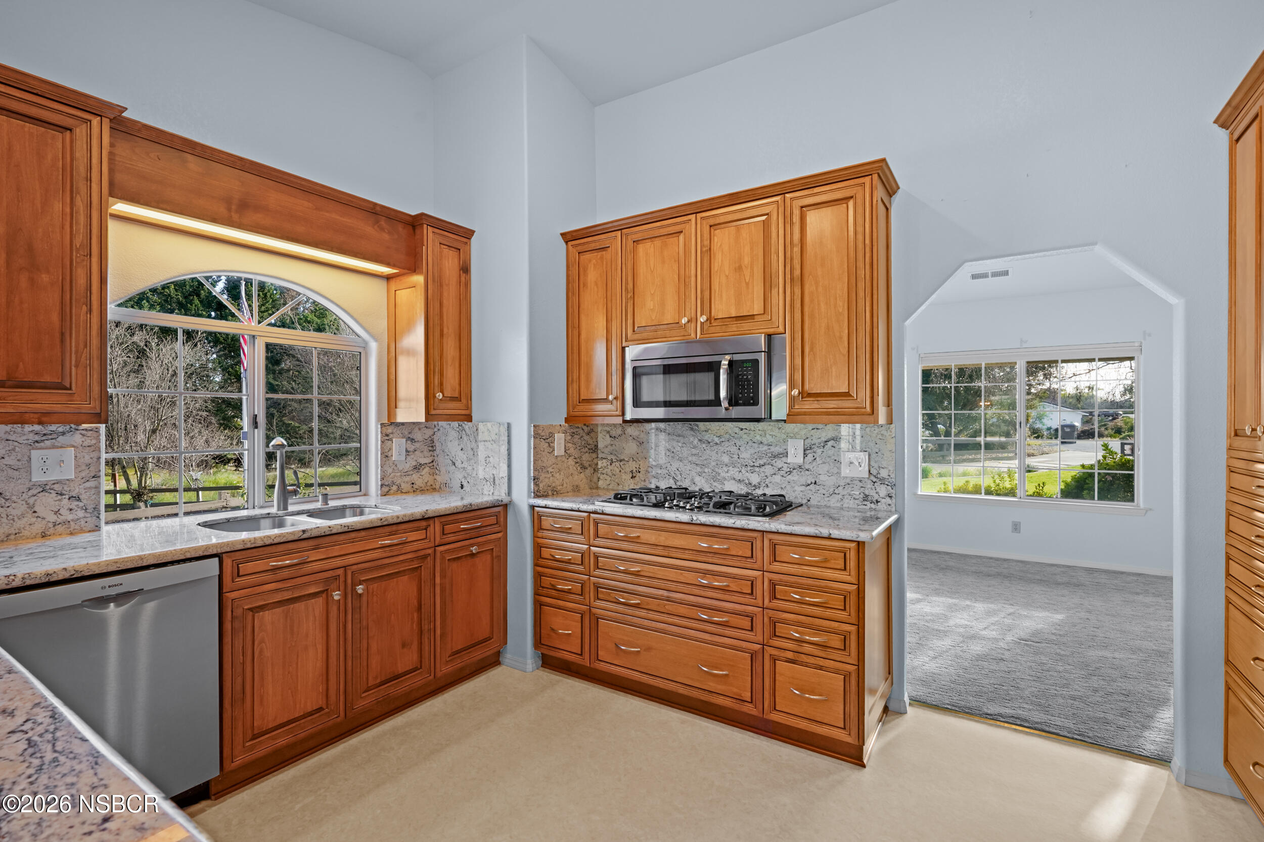 745 Inga Road Nipomo, CA 93444 - Photo 14 of 55 a kitchen with stainless steel appliances granite countertop a stove a sink and a microwave