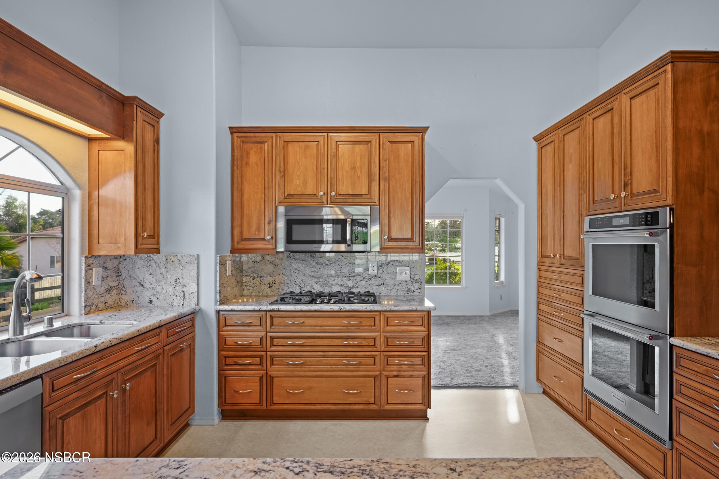 745 Inga Road Nipomo, CA 93444 - Photo 15 of 55 a kitchen with stainless steel appliances granite countertop a refrigerator and a stove