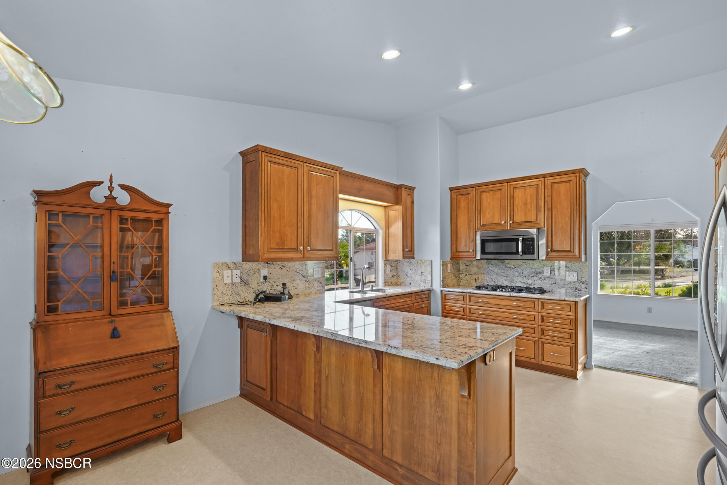 745 Inga Road Nipomo, CA 93444 - Photo 16 of 55 a kitchen with a stove a sink and a microwave