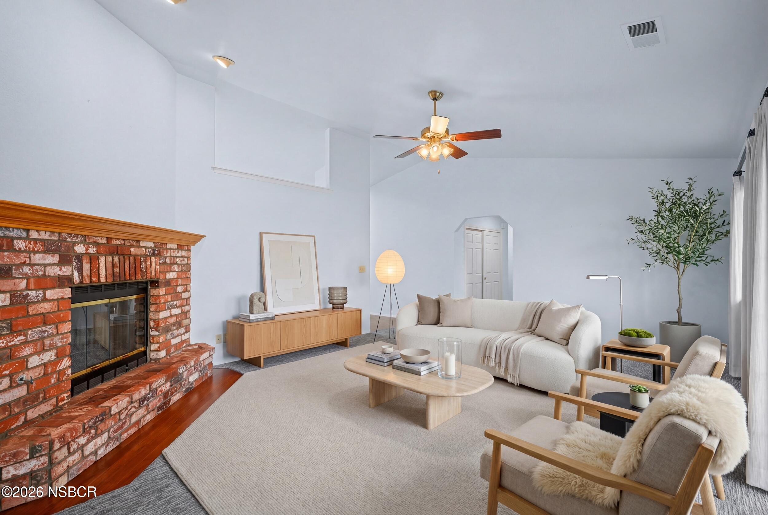 745 Inga Road Nipomo, CA 93444 - Photo 19 of 55 a living room with furniture potted plant and a fireplace