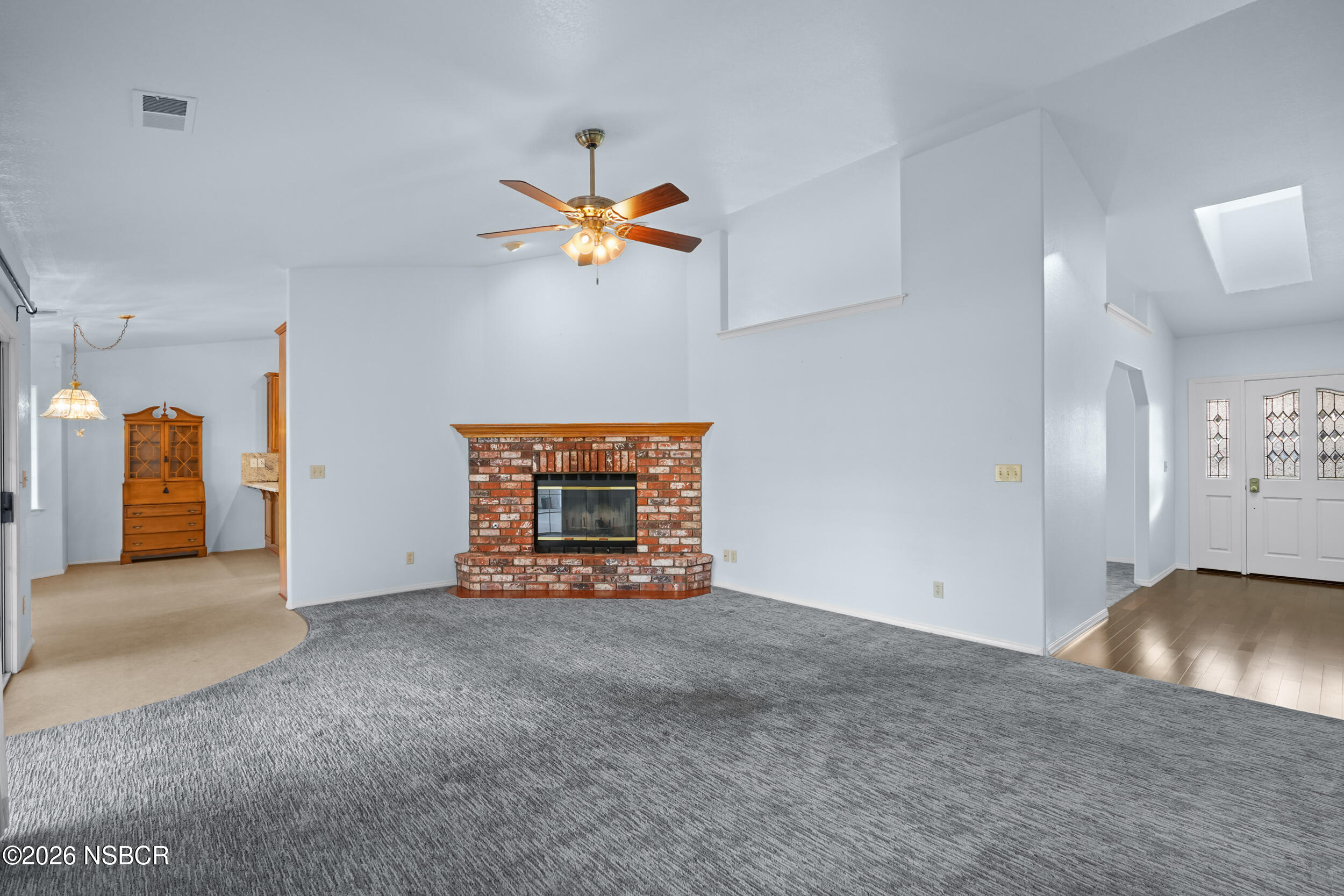 745 Inga Road Nipomo, CA 93444 - Photo 21 of 55 a view of an empty room with a fireplace and a window