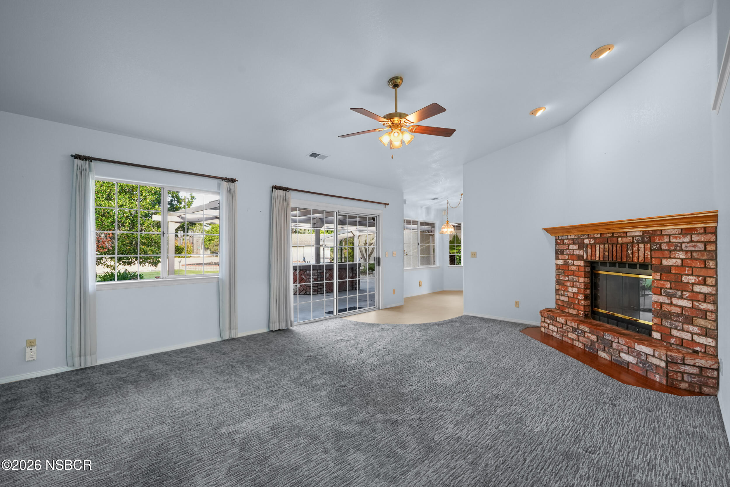 745 Inga Road Nipomo, CA 93444 - Photo 22 of 55 an empty room with windows and fireplace