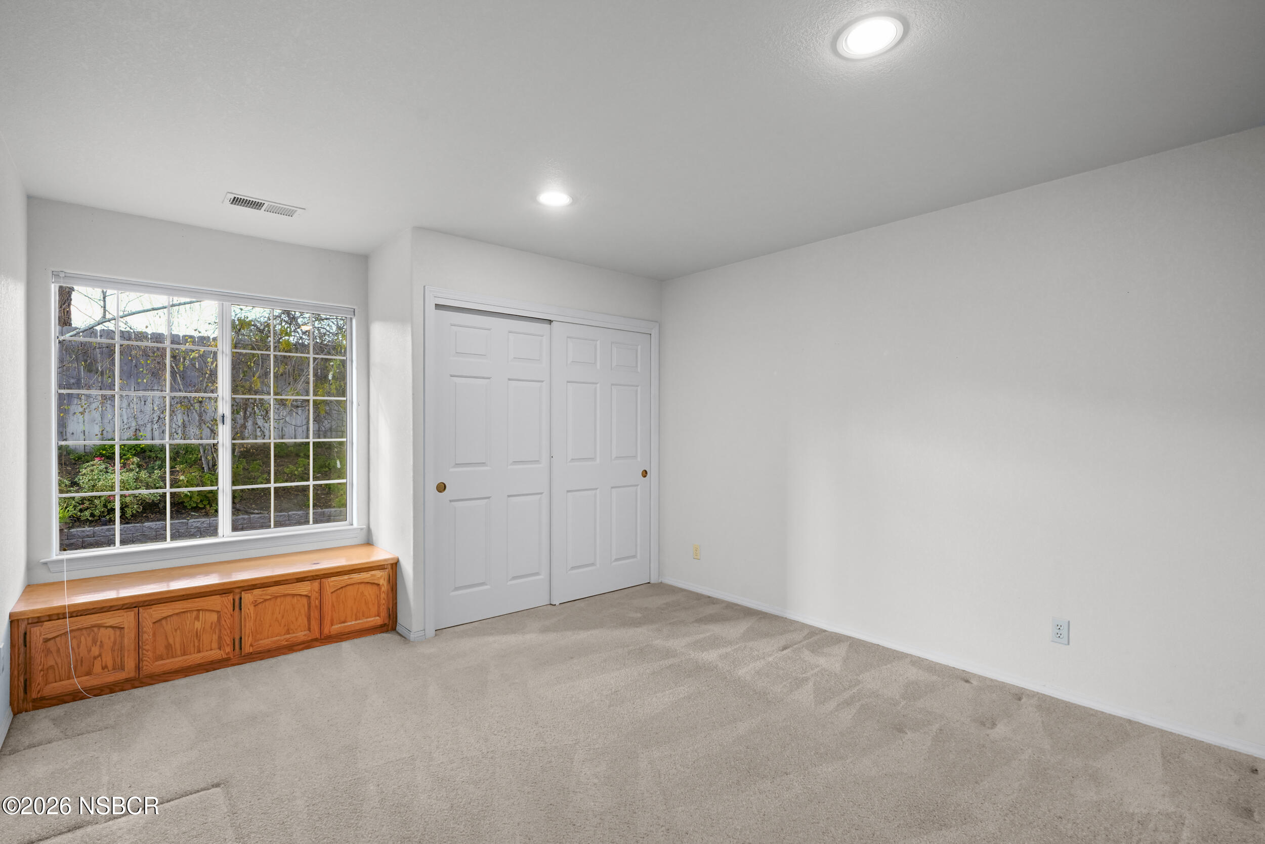745 Inga Road Nipomo, CA 93444 - Photo 29 of 55 an empty room with a window and doors