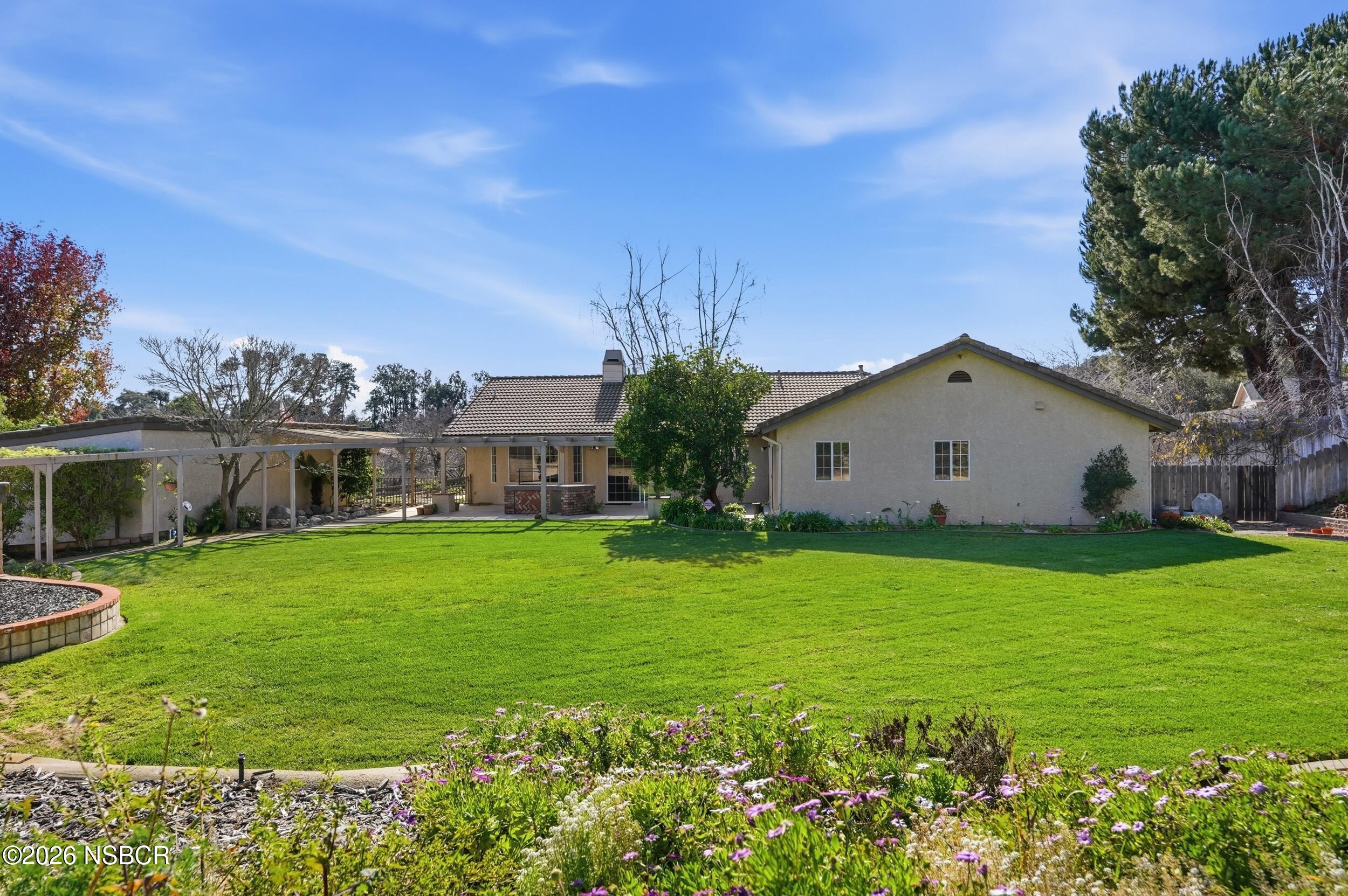 745 Inga Road Nipomo, CA 93444 - Photo 4 of 55 a house view with a garden space