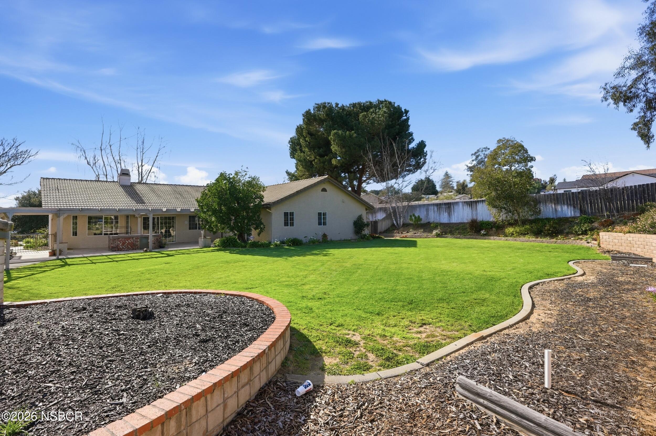 745 Inga Road Nipomo, CA 93444 - Photo 45 of 55 a view of a house with a big yard and large tree