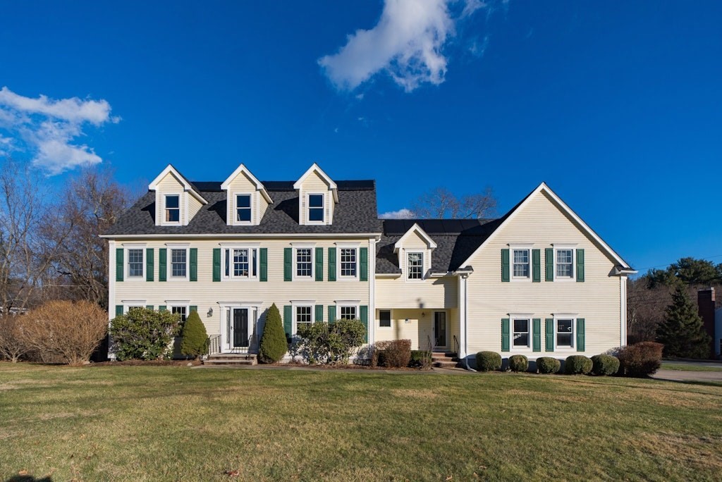 7 Delaney Drive Walpole, MA 02081 - Photo 1 of 35 a front view of a house with a garden