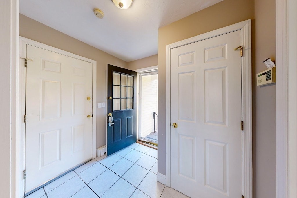 7 Delaney Drive Walpole, MA 02081 - Photo 12 of 35 a view of an entryway with wooden floor