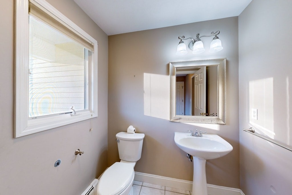 7 Delaney Drive Walpole, MA 02081 - Photo 13 of 35 a bathroom with a sink and a mirror