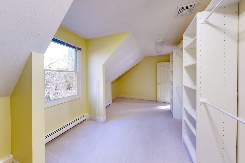 7 Delaney Drive Walpole, MA 02081 - Photo 19 of 35 a view of a hallway with windows