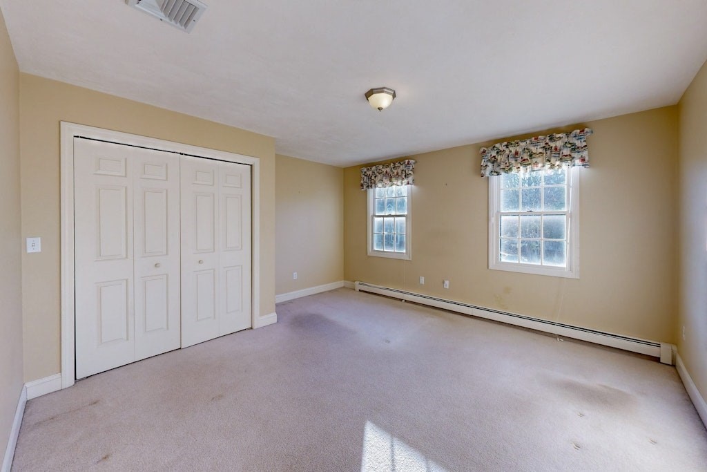 7 Delaney Drive Walpole, MA 02081 - Photo 21 of 35 a view of an empty room with a window