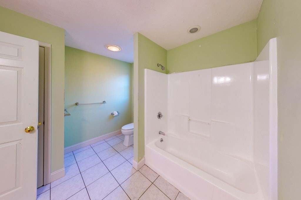7 Delaney Drive Walpole, MA 02081 - Photo 22 of 35 a bathroom with a glass shower door and a shower