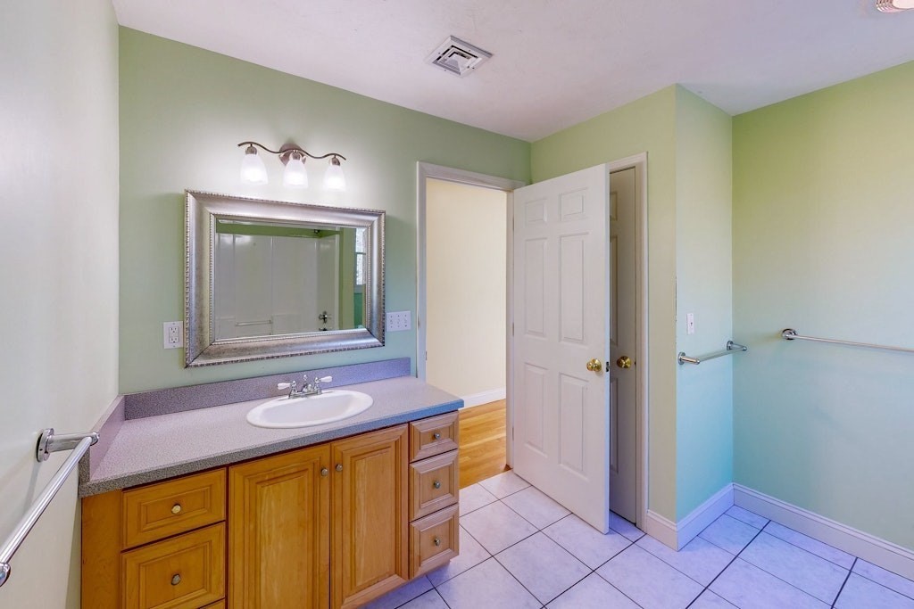 7 Delaney Drive Walpole, MA 02081 - Photo 23 of 35 a bathroom with a sink and a mirror