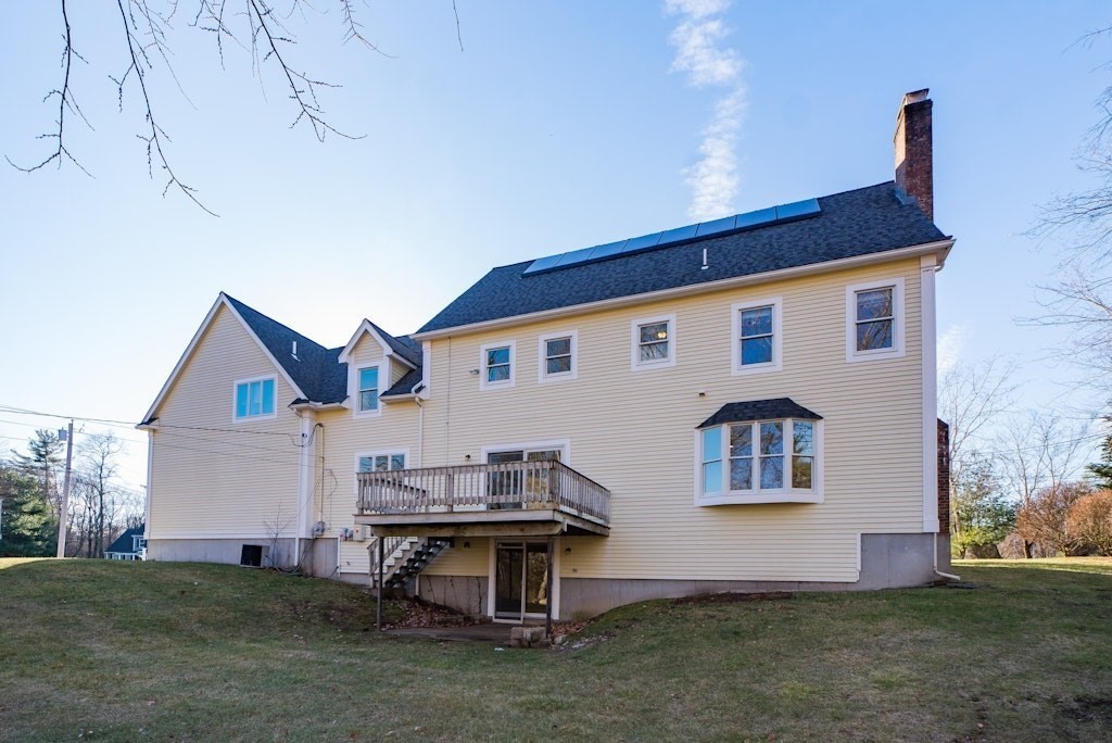 7 Delaney Drive Walpole, MA 02081 - Photo 33 of 35 a front view of a house with a yard
