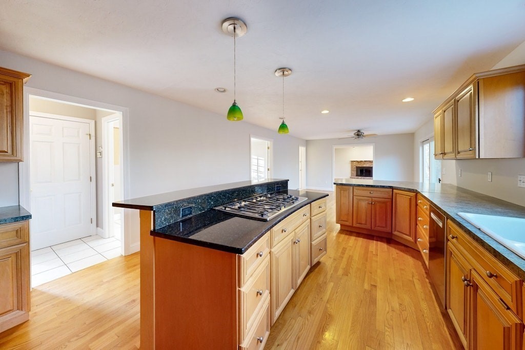7 Delaney Drive Walpole, MA 02081 - Photo 9 of 35 a kitchen with stainless steel appliances granite countertop a stove a sink and a refrigerator